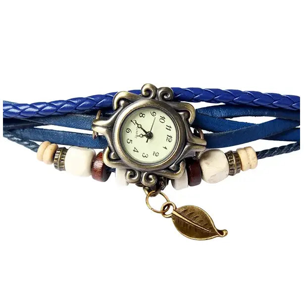 bohemian blue braided leather leaf charm wrap watch featuring a vintage-style silver-toned case and an antique brass leaf charm