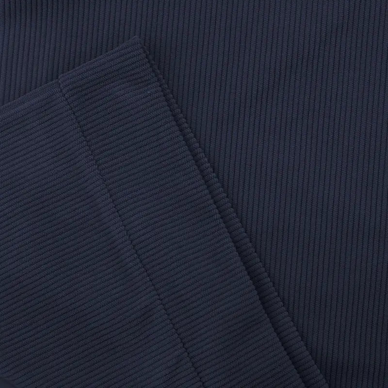 Slim fit corduroy patchwork pullover with contrast accents in dark navy blue featuring distinct vertical ridges on the fabric.