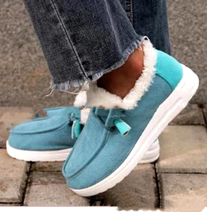 Türkisfarbene Canvas-Slipper-Loafer mit weißem Kunstfellfutter und passenden Quastendetails, entworfen als warme Baumwoll-Flachschuhe für den Winter mit Corduroy-Loafern.