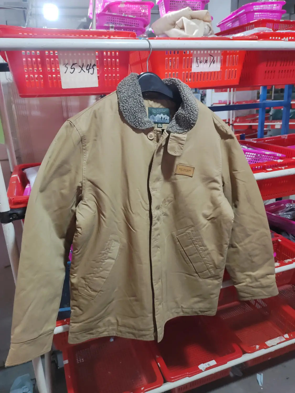 Mens fleece lined winter cotton jacket in tan corduroy with a gray fleece lined collar and a brown leather patch on the chest.