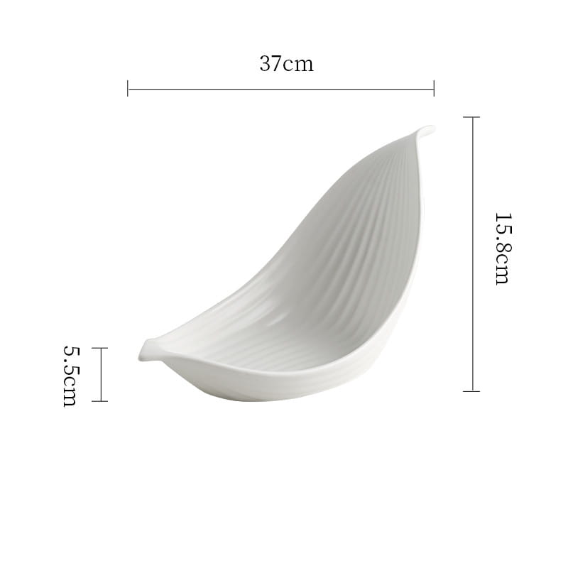 A sleek white leaf ceramic plate with subtle vertical ridges designed as an irregular serving dish.