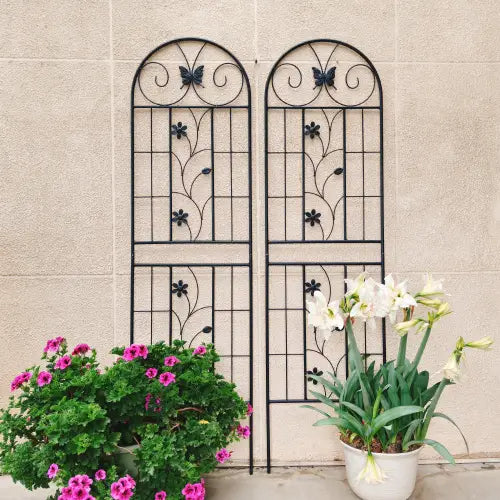 Black wrought iron garden trellis with arched top and butterfly motifs rustproof metal 71 inch 2 pack.