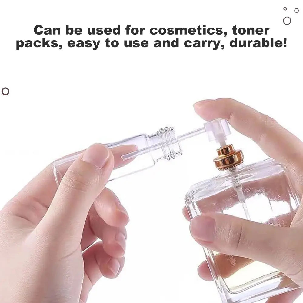 clear glass perfume bottle with gold-toned spray nozzle and transparent cap as part of essential oil dispenser tool set 3pcs mini funnels