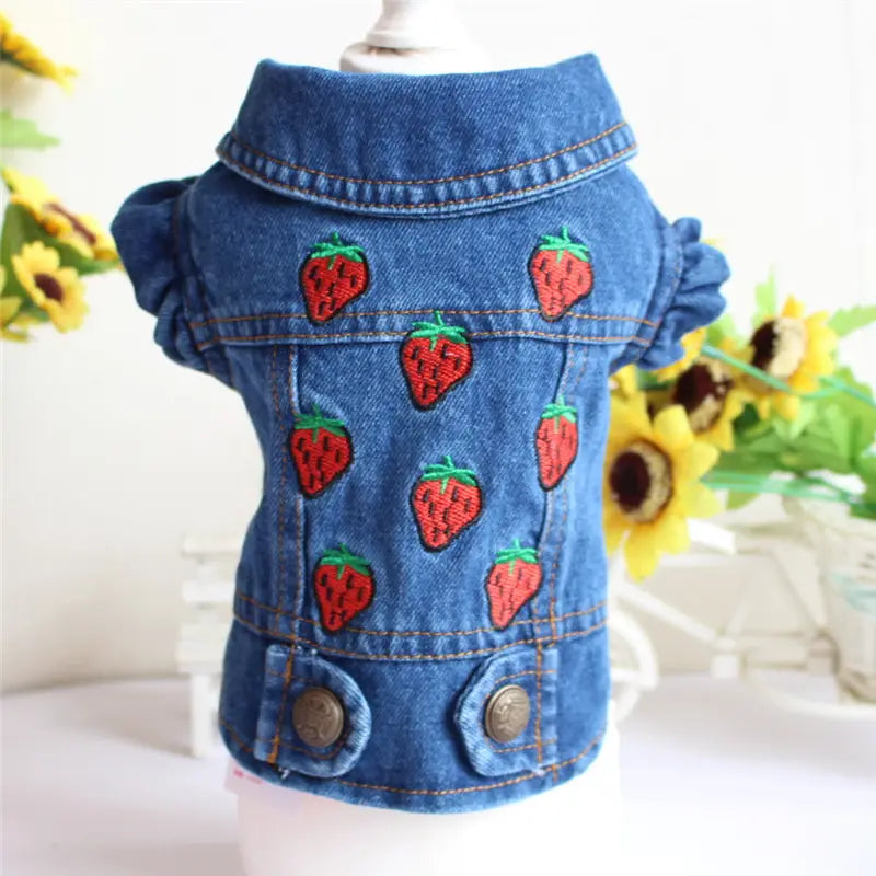 blue denim dog jacket with red strawberry embroidery and ruffled sleeves designed as a puppy vest