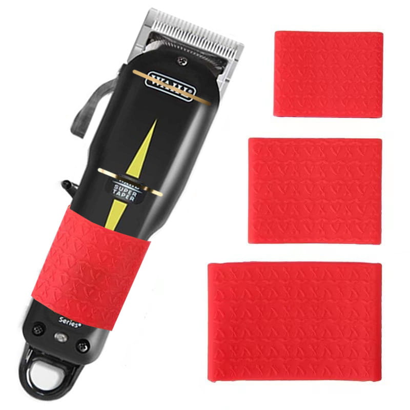 Black and gold Wahl Super Taper electric hair clipper with red anti-slip silicone grip ring for secure handling.