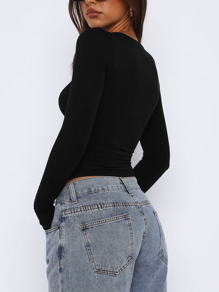 black long-sleeved fitted crop top featuring a leopard star print design suitable for casual wear