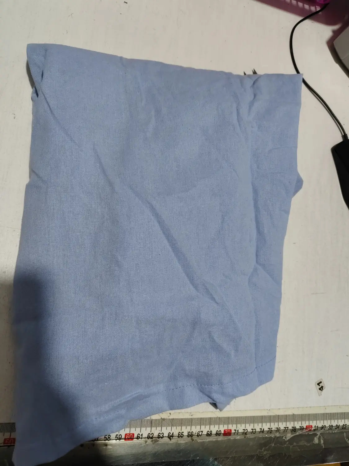 a light blue linen blend wrinkle resistant casual shirt with a subtle woven texture and mandarin collar