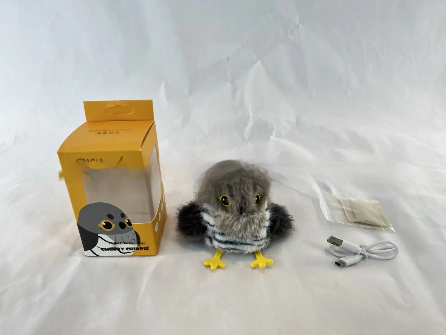 Gray plush owl interactive bird cat toy with yellow feet and striped scarf made of soft fabric featuring automatic sounding capabilities.