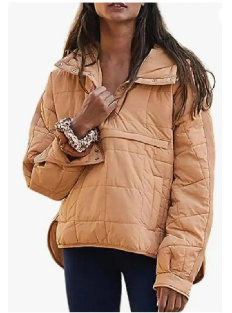 Tan quilted hooded puffer jacket for women made of insulated material with a front zipper and snap-button cuffs.
