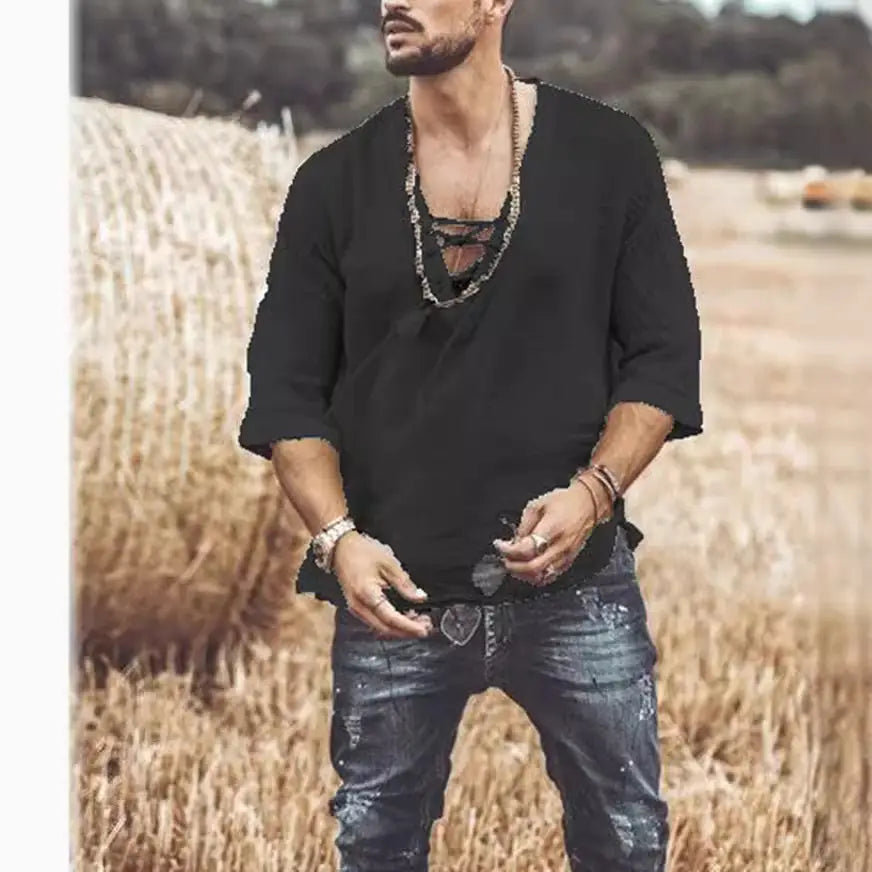 Black loose-fitting textured linen shirt with v-neck and subtle ruching at the front three-quarter sleeves.