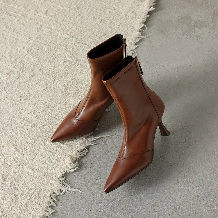 Brown leather ankle boots with pointed toe, slim stiletto heel, cowhide material, and side zipper closure.