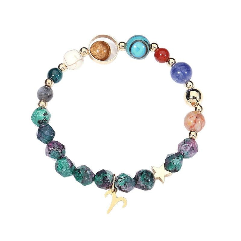 A colorful stretchy natural stone zodiac constellation beaded bracelet featuring gemstones in teal purple blue red and gold with small metallic beads and adorned with a golden star charm and an aries zodiac symbol pendant.