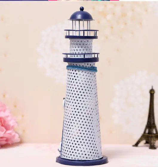 A navy blue and silver perforated metal Mediterranean lighthouse garden statue decor with a domed top and decorative bands.