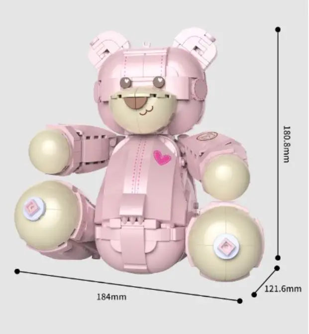 Rosa roboterartiger Teddybär aus 730 ineinandergreifenden Kunststoff-Bausteinen gefertigt, mit beigen kugelförmigen Gliedmaßen, pinken Herz-Akzenten und einem angenäht wirkenden Gesichtsausdruck.