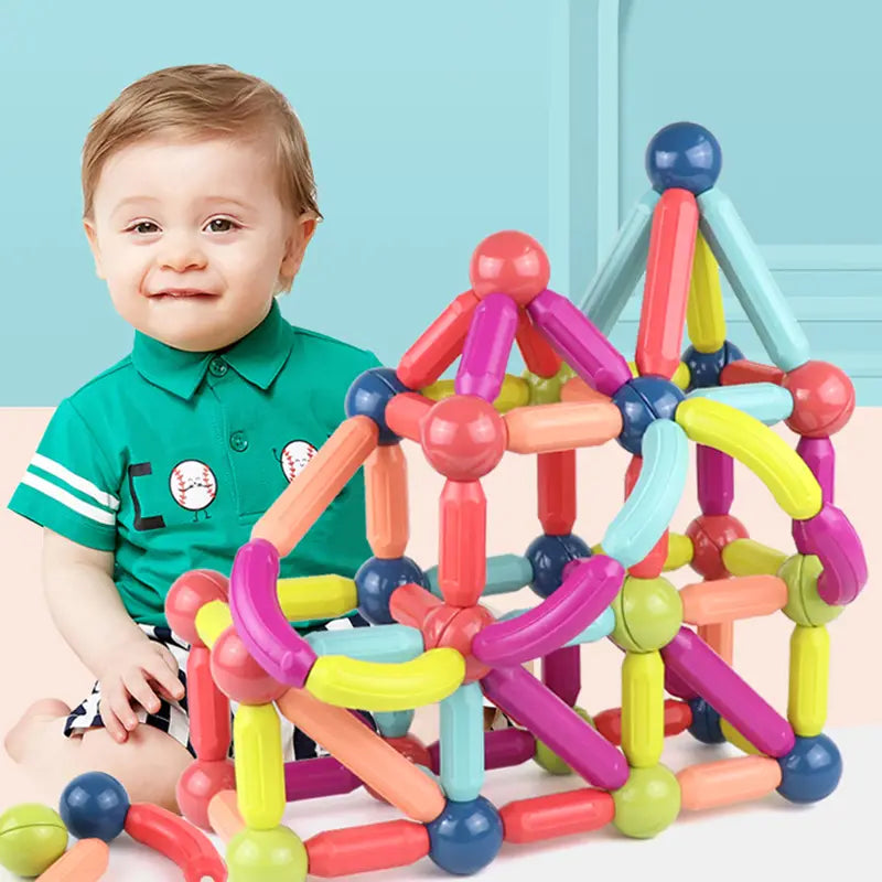 Conjunto de bloques magnéticos multicolor y vibrante para niños que incluye de 50 a 100 piezas con varillas de encastre y conectores esféricos en rosa, amarillo, azul, naranja y verde.