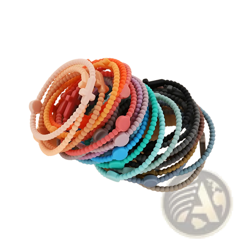A collection of colorful beaded silicone cross bracelets in pastel and vibrant hues with round clasps and decorative charms