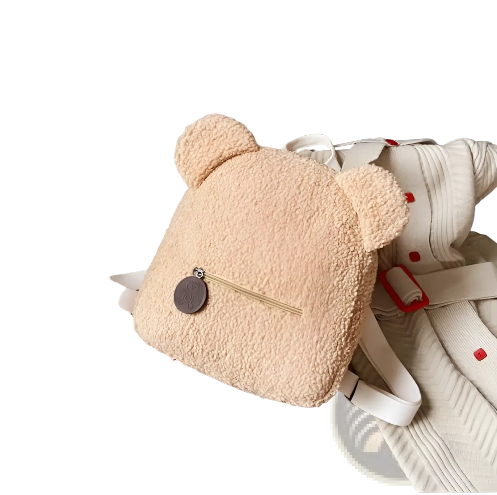 Beige bear shaped plush backpack with white straps and brown circular zipper pull made of fuzzy fleece