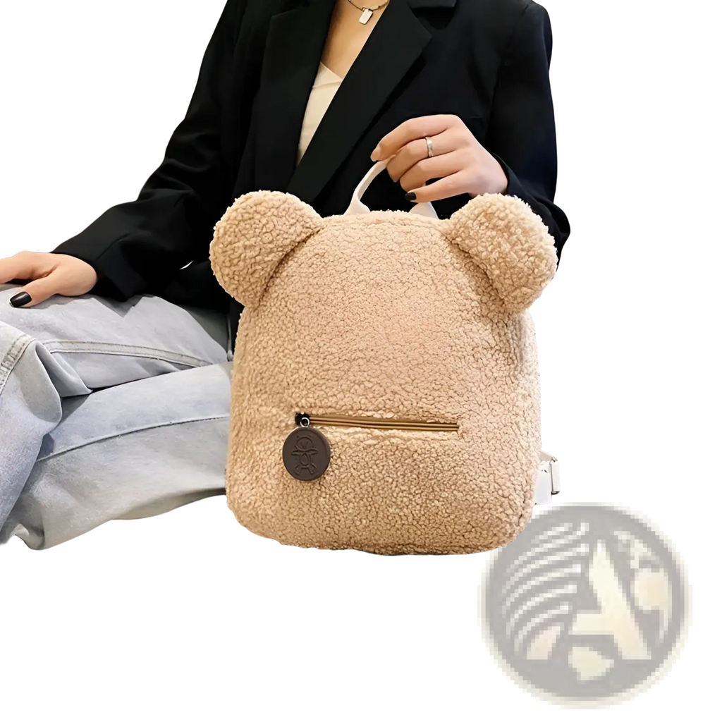 Beige bear shaped plush backpack with soft fuzzy fleece fabric and rounded ears for cute rucksack use