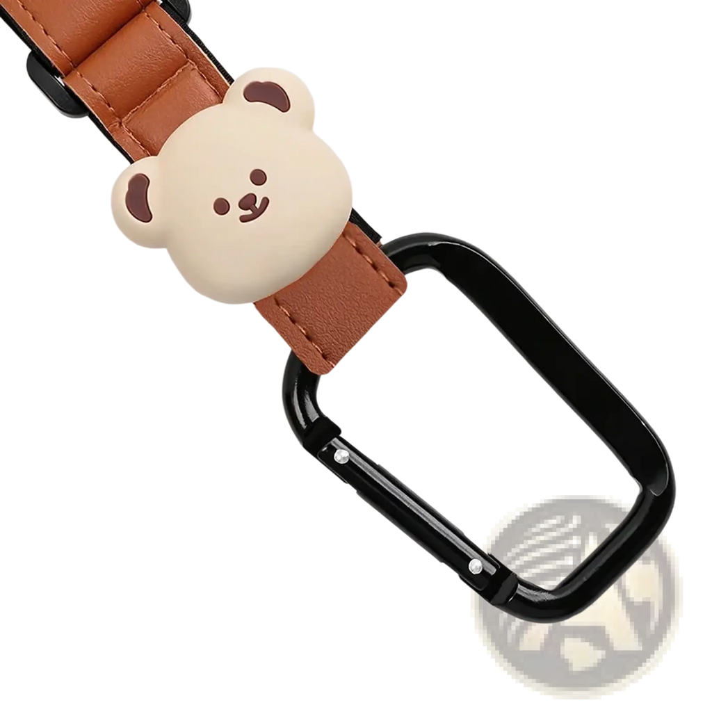 A cute beige bear-shaped pu leather charm attached to a brown strap and black carabiner bear stroller hooks bag hanger