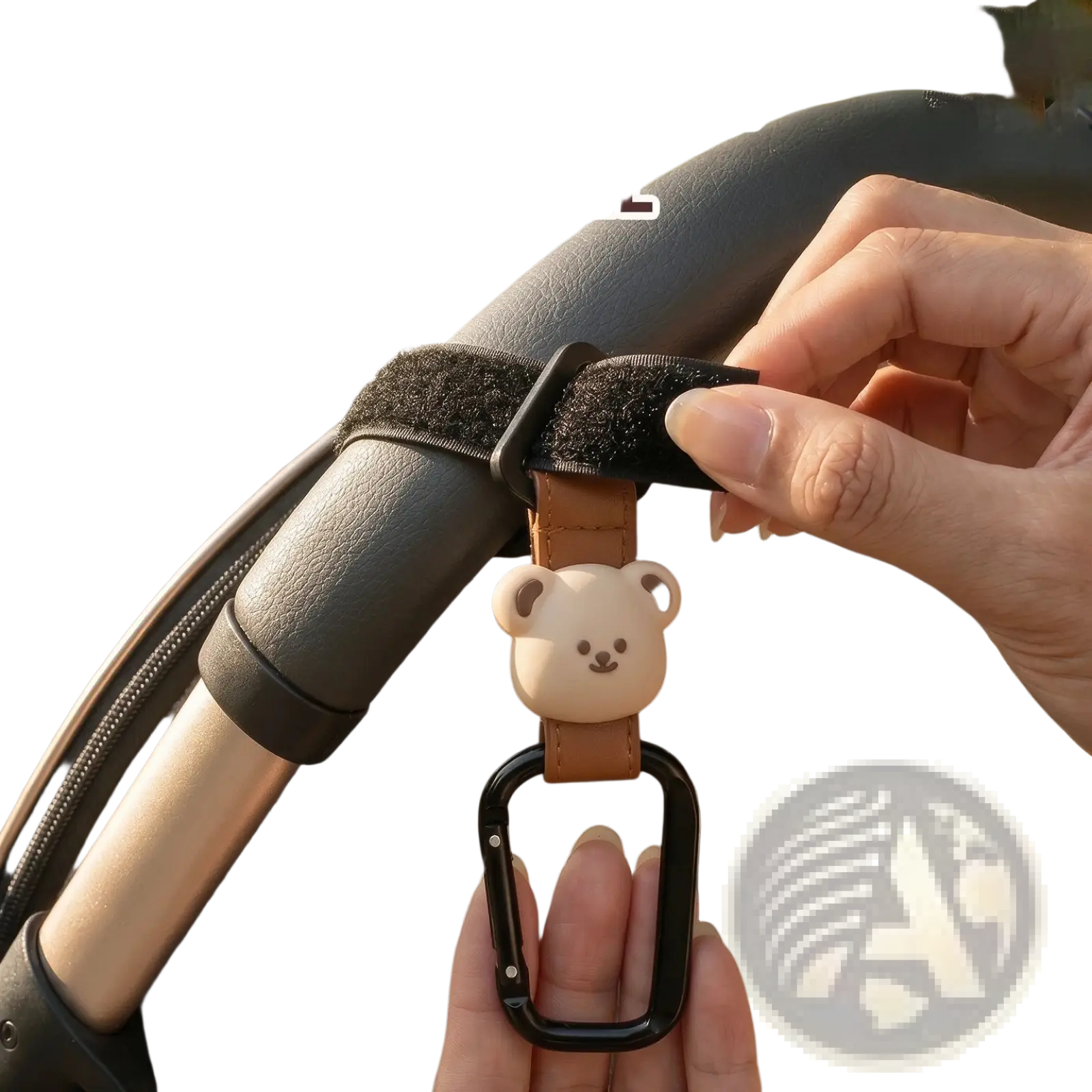 A beige bear-shaped charm on a brown pu leather strap with a black carabiner clip for bear stroller hooks bag hanger