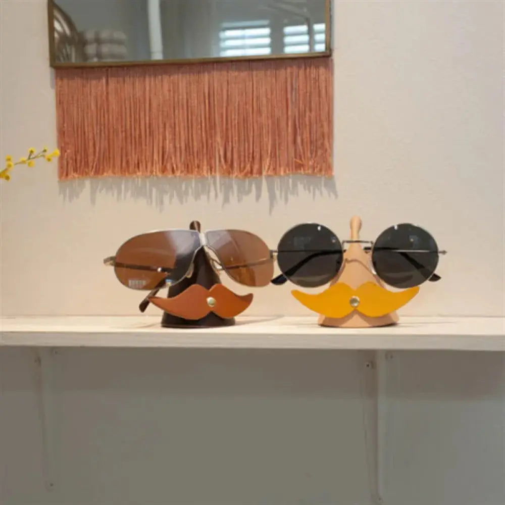 Handmade mustache leather eyeglasses holder stand in dark brown and bright yellow holding stylish sunglasses
