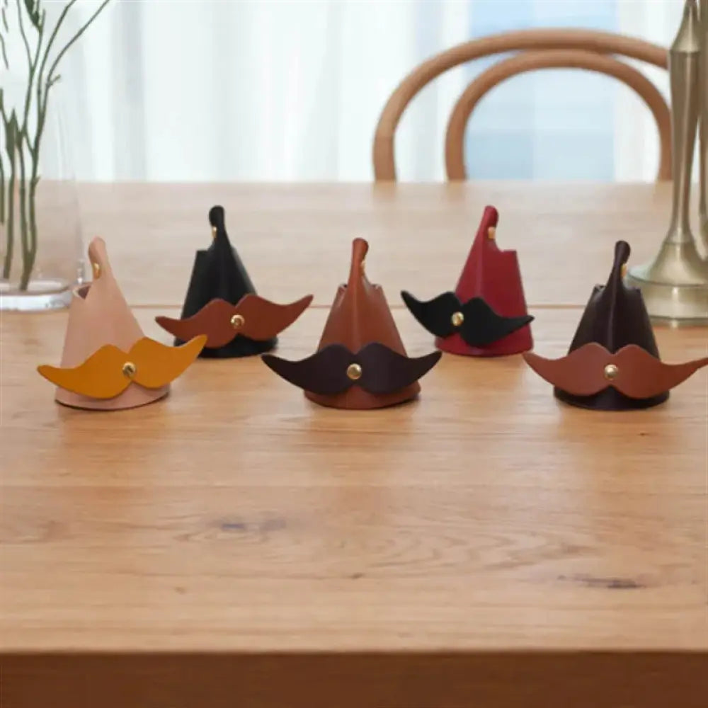 Set of five handmade leather eyeglasses holder stands with matching colored mustaches and gold button accents