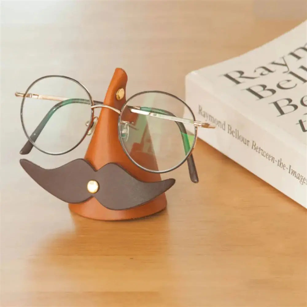 Handmade mustache leather eyeglasses holder stand in orange leather with dark brown faux-leather mustache and gold-tone hardware