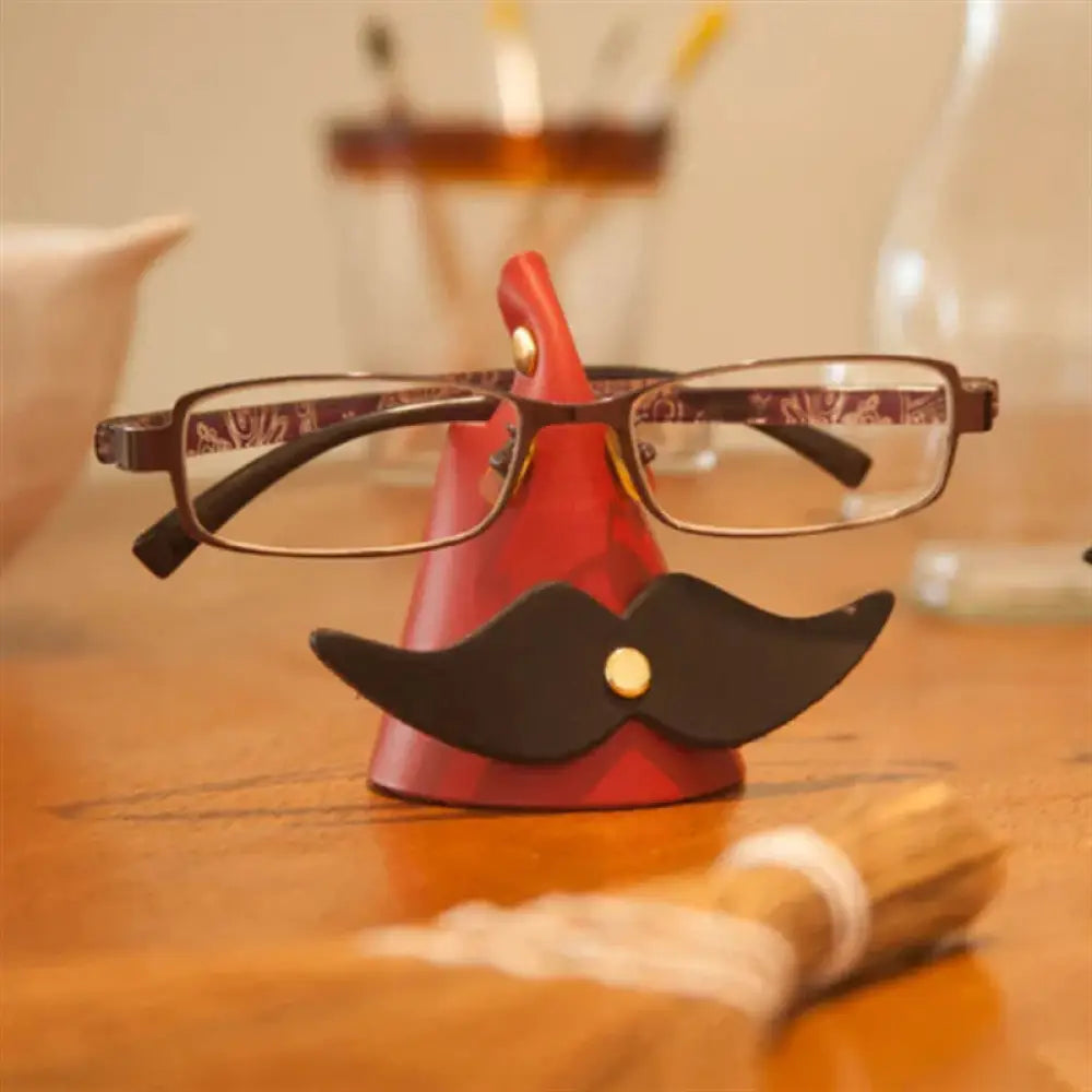 Handmade mustache leather eyeglasses holder stand with red and black novelty design and gold accents