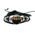 Black braided leather bracelet with circular glass charm featuring The Beatles 1960s album cover and silver metal beads