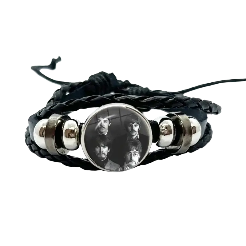 Black braided leather Beatles bracelet with a circular silver bezel holding a black and white photo under glass dome