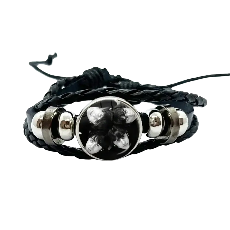 Black braided leather Beatles bracelet with silver metal beads and circular glass dome charm featuring band photo