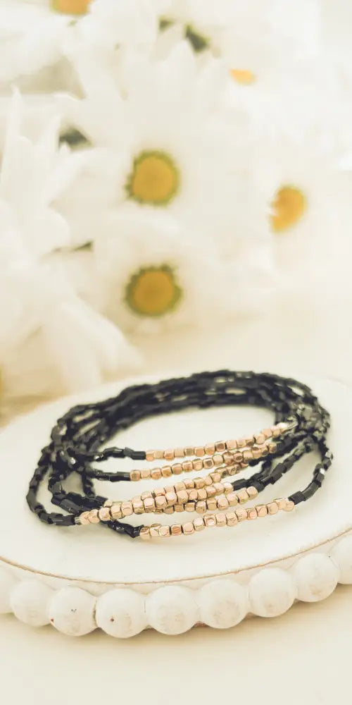 Elegant black and rose gold beaded wrap bracelet set featuring a delicate layered design in a sophisticated style