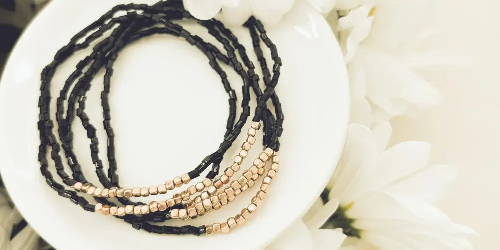 Elegant black and rose gold layered beaded bracelet set featuring black and rose gold beads in a wrap design