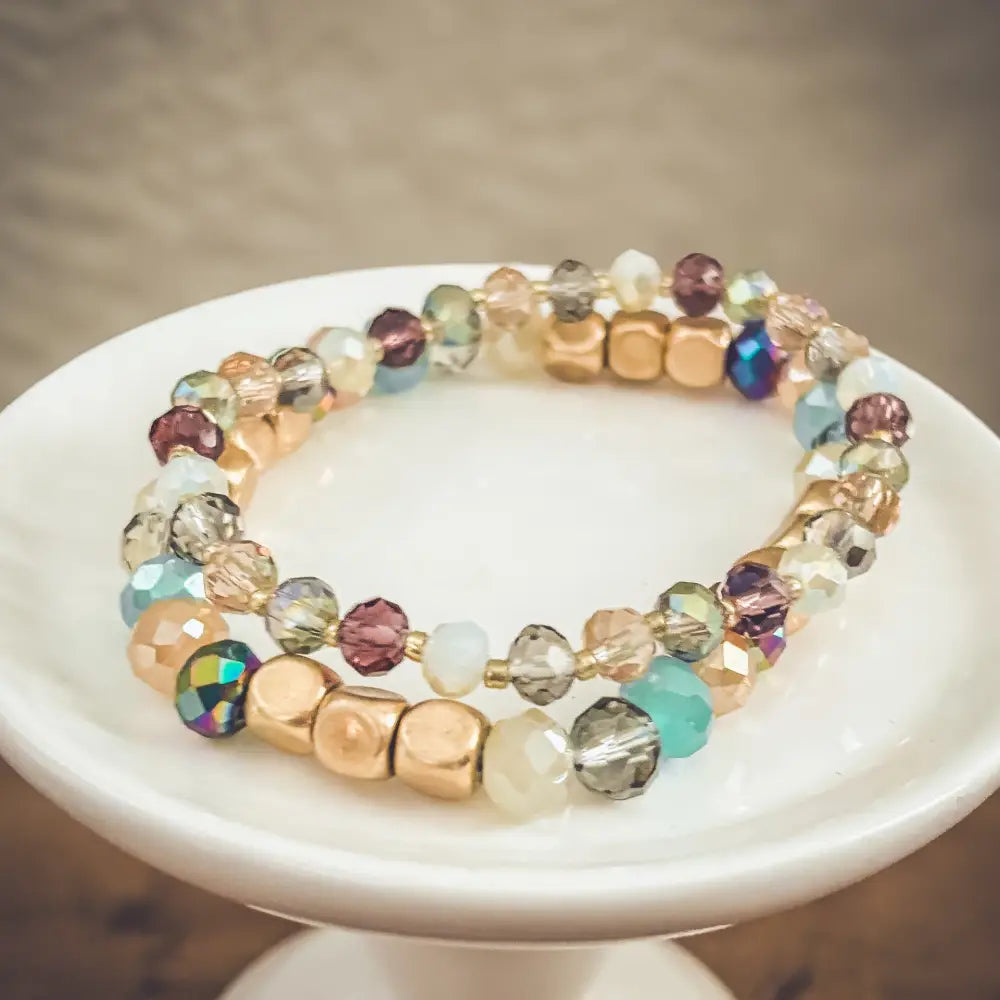 Bohemian earth tone iridescent beaded double-strand bracelet with faceted crystals and pastel rose gold beads