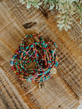 Colorful glass bead stacking bracelet set with multicolored tiny beads and gold-toned tree of life charms