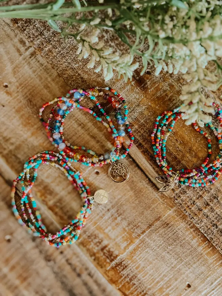 Tree of life colorful glass bead stacking bracelet set with metallic tree of life and leaf charms wrapped around wrist