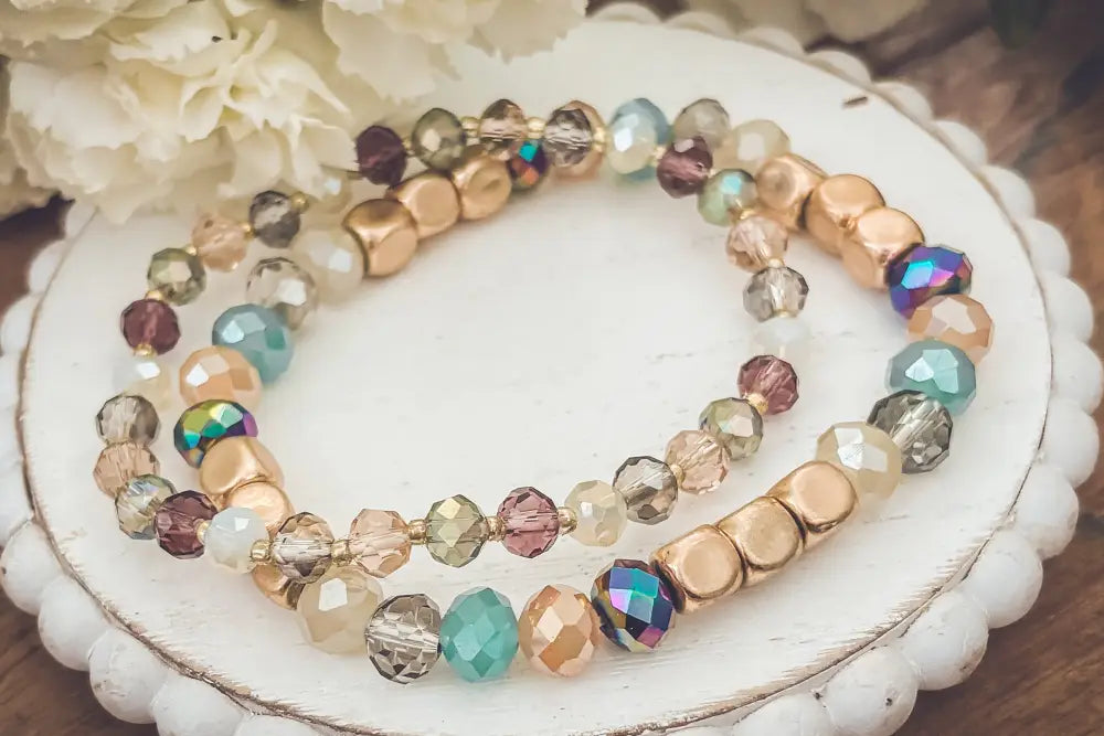 Bohemian earth tone iridescent beaded stacking bracelet set with delicate multi-strand gold and teal amber mauve beads