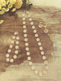 Gold daisy enamel necklace and earrings jewelry set with gold-toned metal and white enamel petals with yellow centers