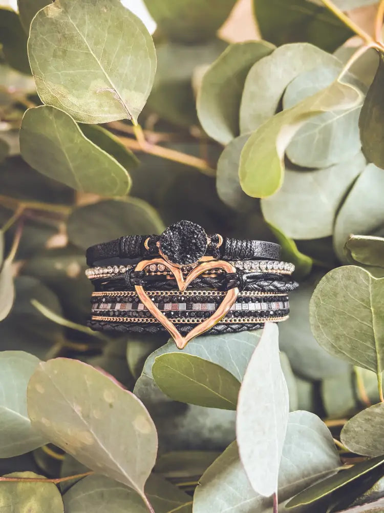 Layered black leather wrap bracelet with rose gold heart charm and beaded details for elegant wear