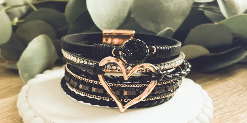 Layered black leather wrap bracelet with rose gold heart charm and crystal druzy accents for elegant wear