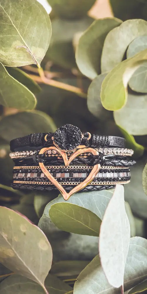 Layered black leather bracelet set with rose gold heart charm featuring crystals and a central black druzy stone