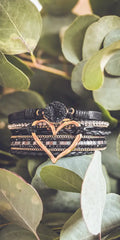 Layered black leather bracelet set with rose gold heart charm featuring crystals and a central black druzy stone