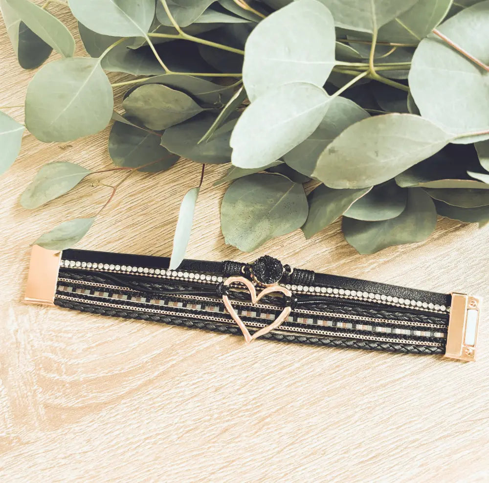 Layered black leather multi-strand bracelet with rose gold-tone heart clasp and rhinestone accents