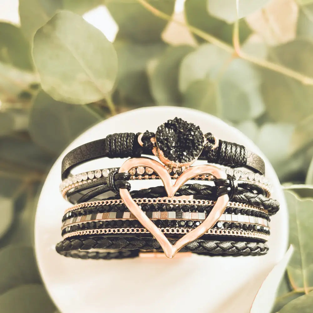 Layered black leather multi-strand wrap bracelet with rose gold heart charm and black druzy stone accent