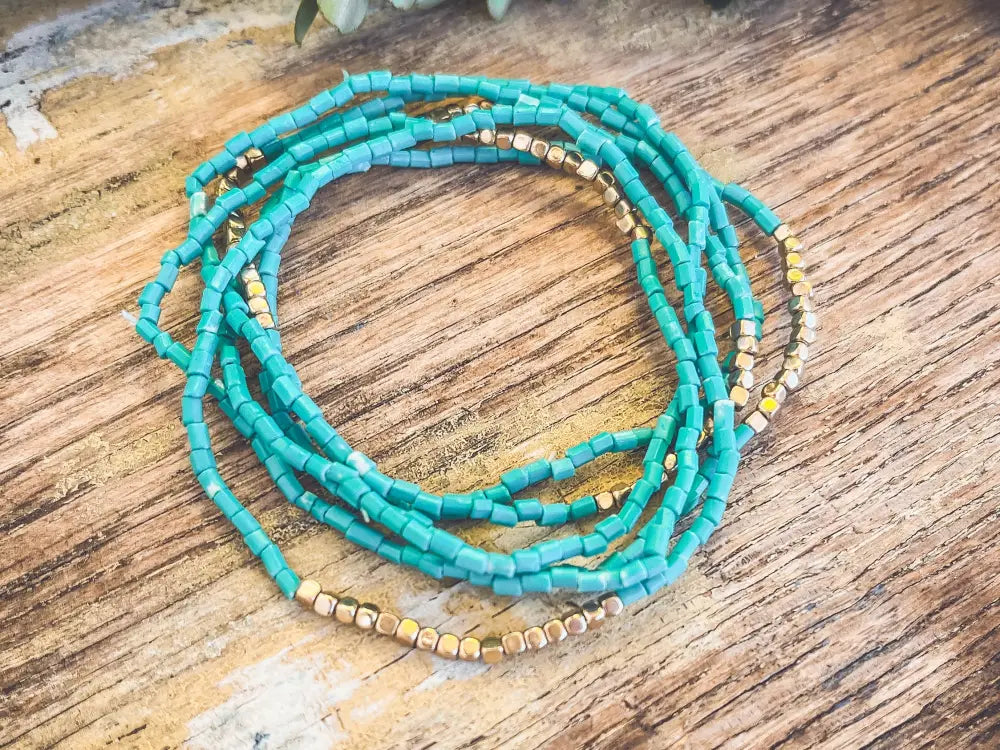 Boho turquoise and gold beaded stacking wrap bracelet featuring vibrant turquoise beads and gold accents for stylish layering