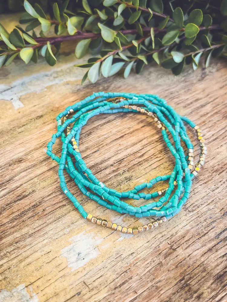 Boho turquoise and gold beaded stacking wrap bracelet featuring vibrant turquoise beads and gold accents