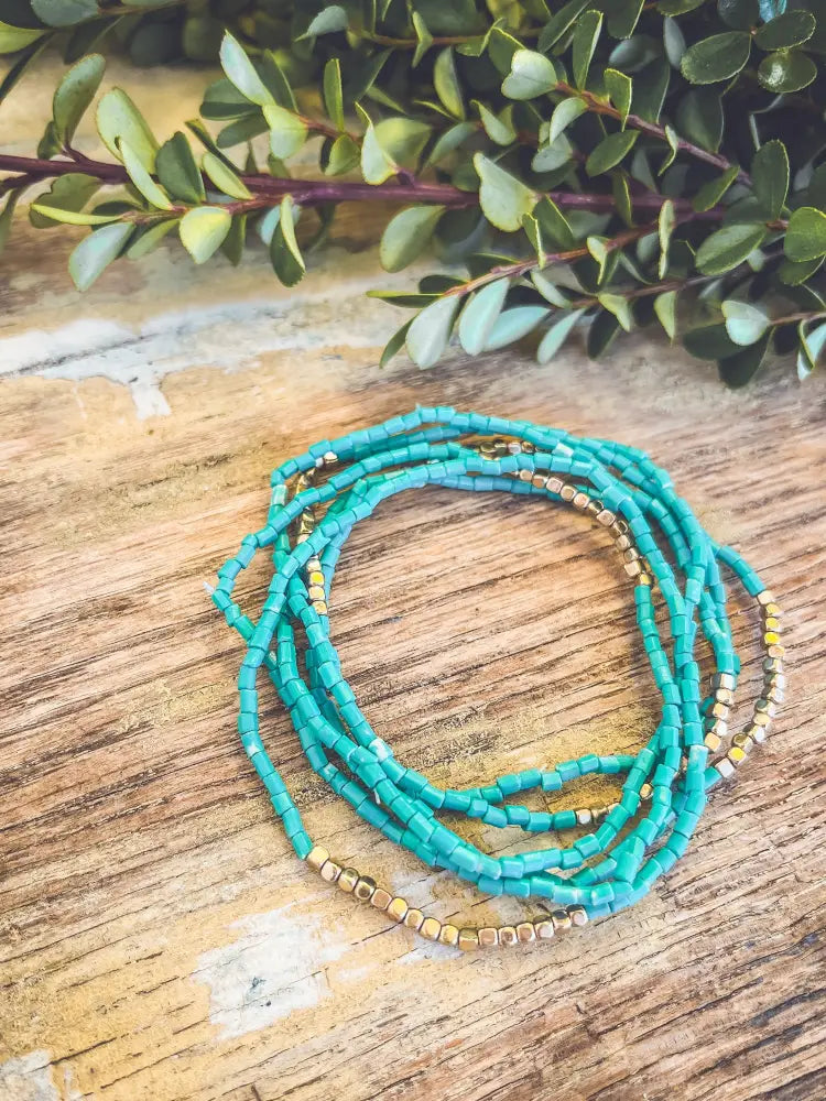Boho turquoise and gold beaded stacking wrap bracelet featuring vibrant turquoise beads and gold accents