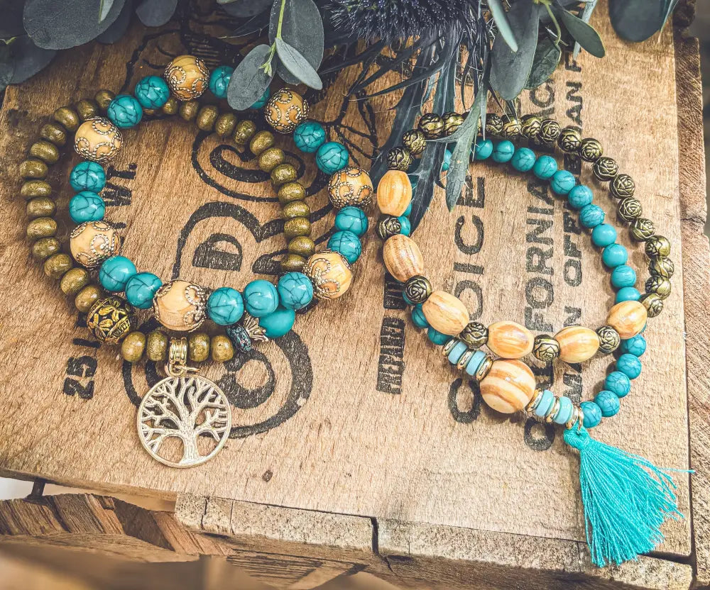 Turquoise tree of life and wood beaded bracelet set featuring gold-toned beads with a pendant and matching tassel