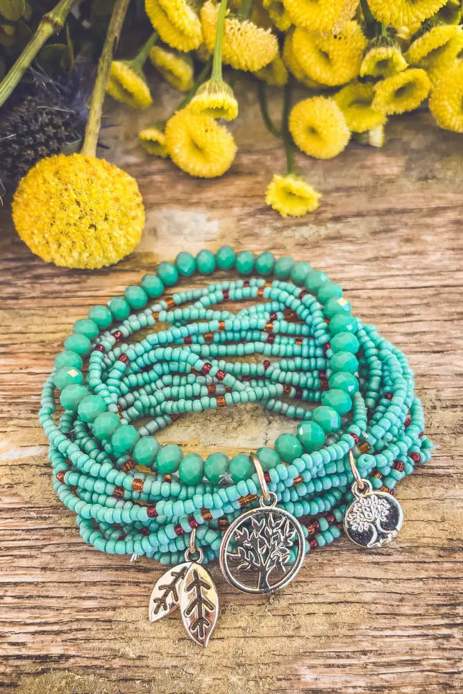 Turquoise tree of life beaded wrap bracelet set featuring silver tree of life and leaf charms on turquoise beads