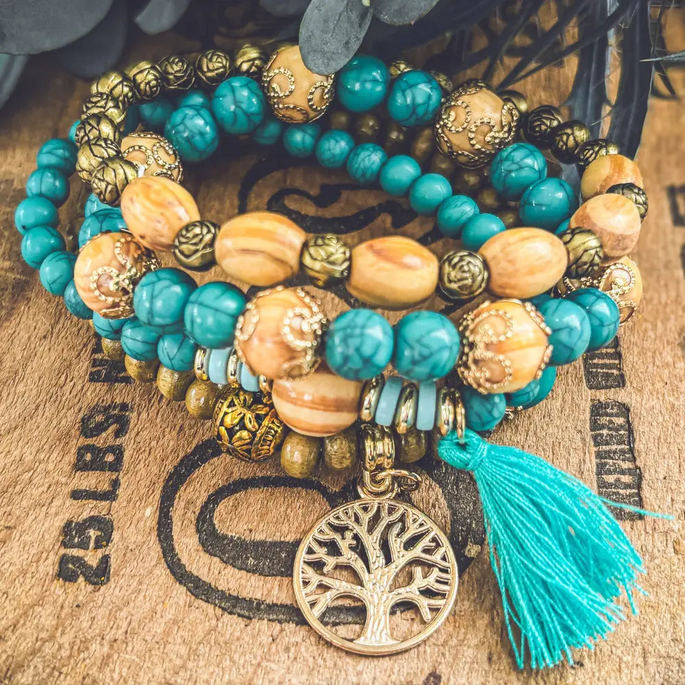 Turquoise tree of life and wood beaded bracelet set with amber beads gold-toned accents and matching tassel charm